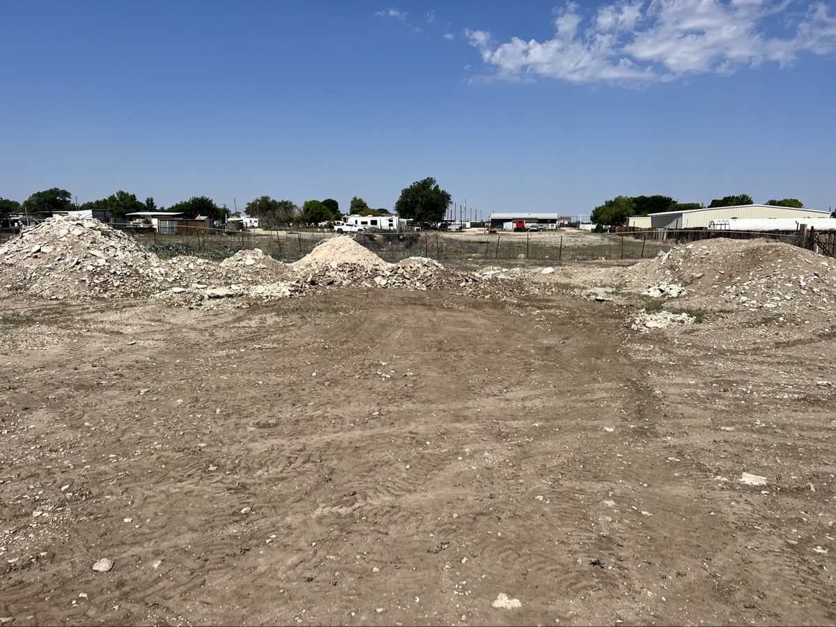 Dirt work site with stockpiled material