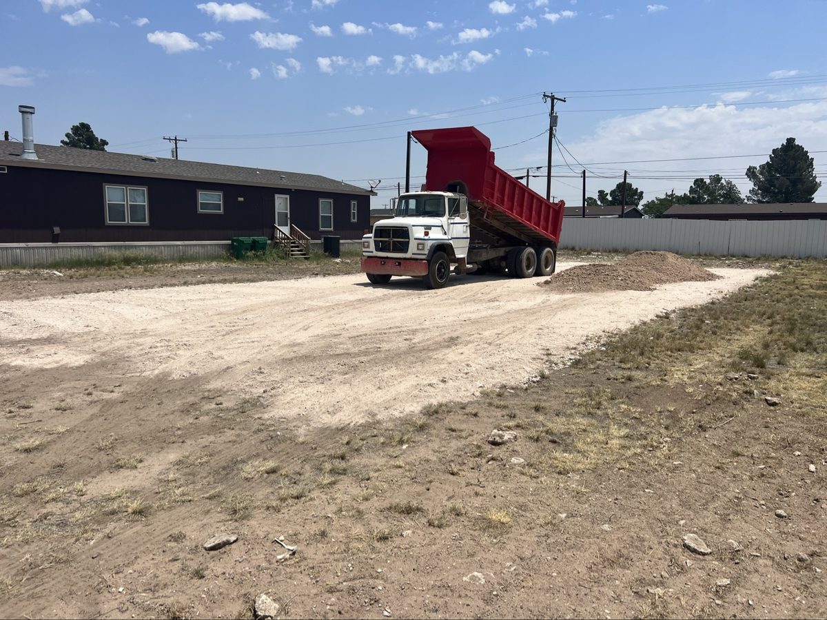 Dump truck dumping a load of dirt